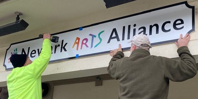 NAA sign being installed at 207 Louviers Dr.