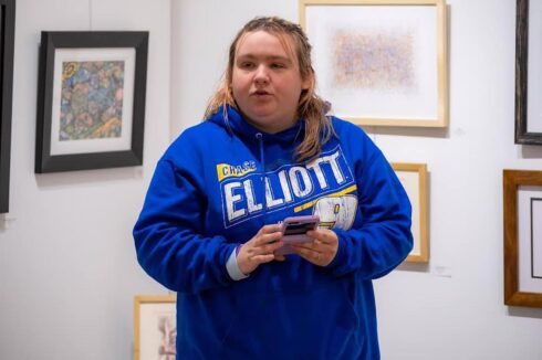 Image showing a young artist speaking during open mic night