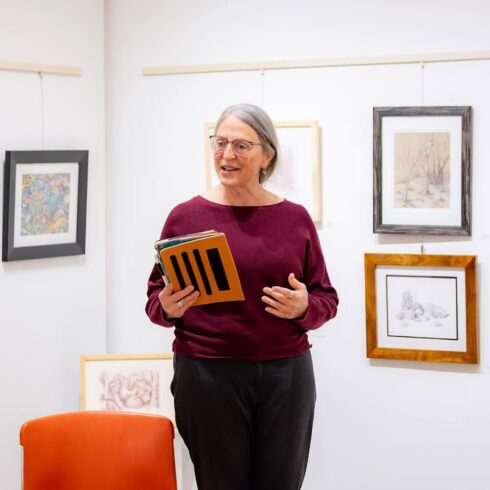 Image showing an artist speaking during open mic night
