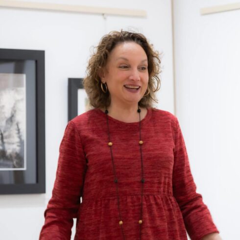 Image showing an artist performing during an open mic night in the gallery